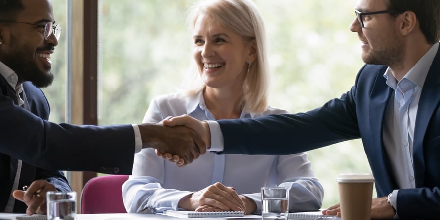 Diverse-group-of-business-reps-shaking-hands