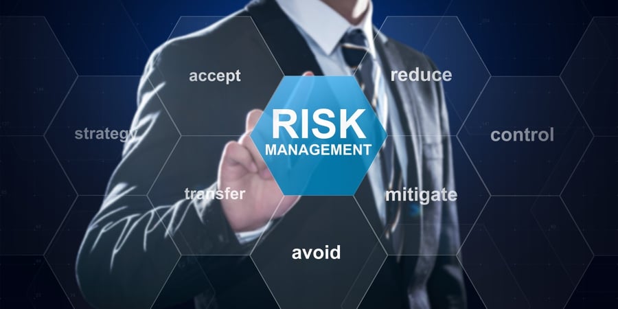 man-in-suit-tapping-risk-management-button